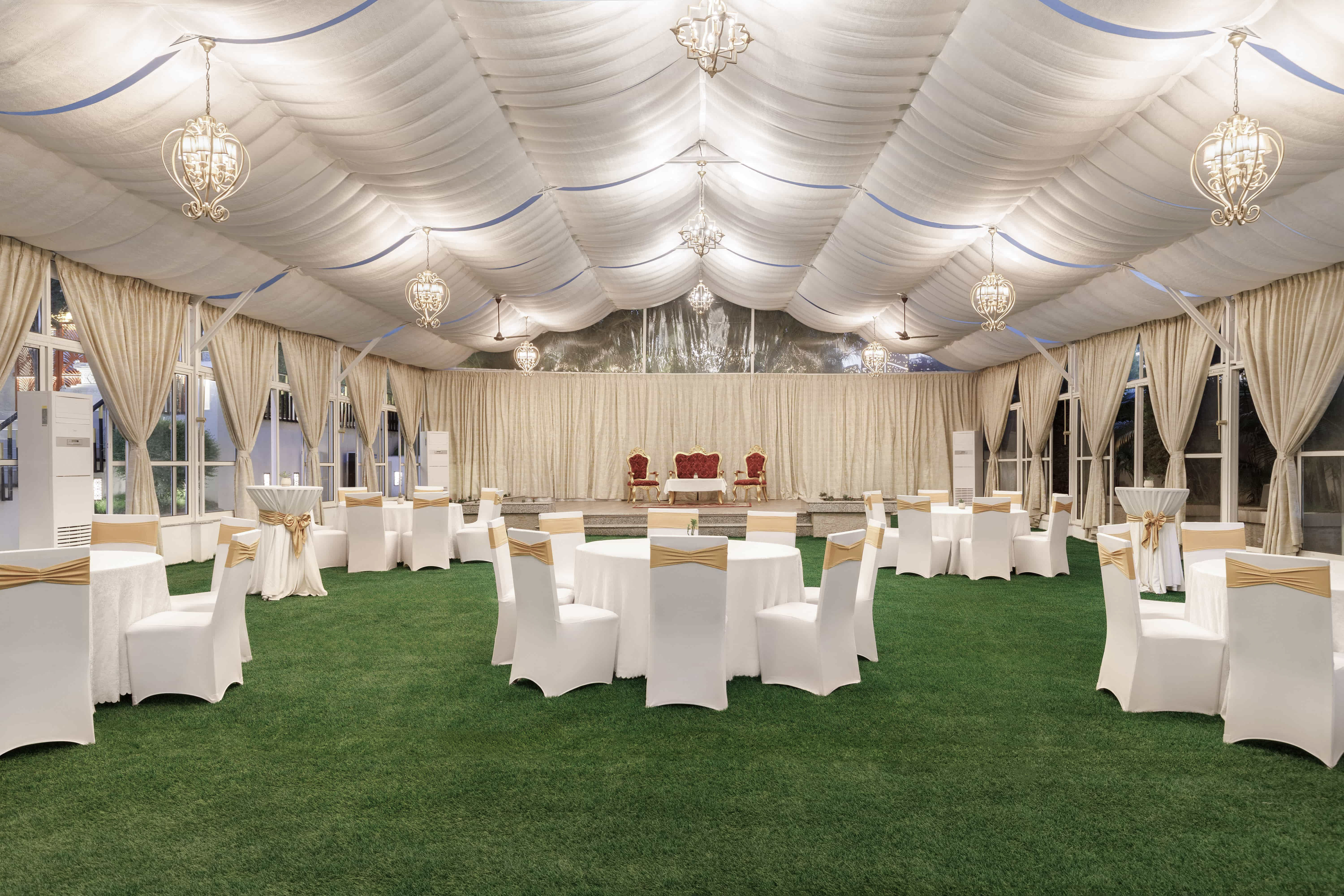 Tent and garden event space with banquet seating